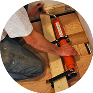 Small photo of Cepco Tool Quikjack working on  hardwood floor boards
